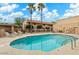 Community pool with lounge chairs and surrounding patio at 12635 N La Montana Dr # 1, Fountain Hills, AZ 85268