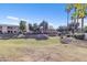 Landscaped green space with rock water feature at 10030 W Indian School Rd # 218, Phoenix, AZ 85037