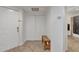 Bright entryway with tile flooring, coat bench, and storage closet at 10030 W Indian School Rd # 218, Phoenix, AZ 85037