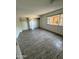 Large bedroom with ample closet space and wood-look floors at 3023 W Larkspur Dr, Phoenix, AZ 85029