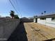 Backyard view showing grassy area and block wall at 3023 W Larkspur Dr, Phoenix, AZ 85029