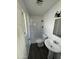 Clean bathroom with shower and pedestal sink at 3023 W Larkspur Dr, Phoenix, AZ 85029