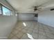 Spacious living room with tile floors and ceiling fan at 3023 W Larkspur Dr, Phoenix, AZ 85029