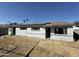 House with backyard, grassy area, and solar panels at 3023 W Larkspur Dr, Phoenix, AZ 85029