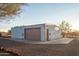 Detached workshop with large garage door and side door at 43630 N 20Th St, New River, AZ 85087