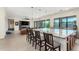 Kitchen island with seating overlooking the living room and fireplace at 9626 S 7Th Pl, Phoenix, AZ 85042