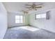 Bright bedroom with ceiling fan and large windows at 19409 N 45Th Dr, Glendale, AZ 85308