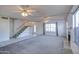 Living room with stairs, fireplace and ceiling fan at 19409 N 45Th Dr, Glendale, AZ 85308