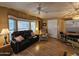 Living room features hardwood floors, bay window, and comfortable seating at 8700 E University Dr # 1931, Mesa, AZ 85207