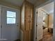 Hallway with storage cabinets and access to other rooms at 8700 E University Dr # 1931, Mesa, AZ 85207
