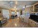 Open kitchen with light wood cabinets, white appliances, and a breakfast nook at 8700 E University Dr # 1931, Mesa, AZ 85207