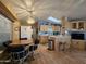 Bright kitchen with light wood cabinets and breakfast bar at 8700 E University Dr # 1931, Mesa, AZ 85207
