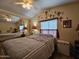 Bedroom with a double bed, ceiling fan, and decorative wall at 8700 E University Dr # 1931, Mesa, AZ 85207