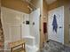 Bathroom with walk-in shower, built-in seat, and grab bar at 8700 E University Dr # 1931, Mesa, AZ 85207