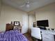 Bedroom with double bed, desk, and built-in mirrored closet at 8700 E University Dr # 1931, Mesa, AZ 85207