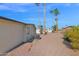 Backyard with gravel landscaping, palm trees, and AC unit at 5402 E Mckellips Rd # 236, Mesa, AZ 85215