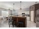 Modern kitchen with an island, stainless steel appliances, and ample counter space at 20903 S 185Th Way, Queen Creek, AZ 85142