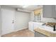 Convenient laundry room with washer, dryer, and utility sink at 1367 E Desert Flower Ln, Phoenix, AZ 85048