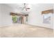 Spacious Primary bedroom with carpet flooring, ceiling fan, and private balcony access at 1367 E Desert Flower Ln, Phoenix, AZ 85048