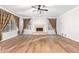 Spacious living room with hardwood floors, fireplace, and natural light at 1367 E Desert Flower Ln, Phoenix, AZ 85048