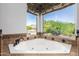 Spa-like bathroom with corner soaking tub and mountain views at 1367 E Desert Flower Ln, Phoenix, AZ 85048