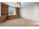 Bright bedroom featuring built-in shelves and a window seat at 1367 E Desert Flower Ln, Phoenix, AZ 85048