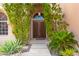 Double front doors with decorative accents and sidelights at 1367 E Desert Flower Ln, Phoenix, AZ 85048