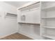 Spacious walk-in closet with ample shelving and hanging space at 1367 E Desert Flower Ln, Phoenix, AZ 85048