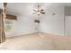 Spacious bedroom with carpeted floors and window coverings at 1367 E Desert Flower Ln, Phoenix, AZ 85048