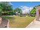 Expansive grassy backyard with pool and landscaping at 1367 E Desert Flower Ln, Phoenix, AZ 85048