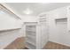 Large walk-in closet, built-in shelves and drawers at 1367 E Desert Flower Ln, Phoenix, AZ 85048