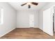 Spacious bedroom with hardwood floors and ceiling fan at 1367 E Desert Flower Ln, Phoenix, AZ 85048