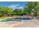 Relaxing kidney-shaped pool with rock features at 1367 E Desert Flower Ln, Phoenix, AZ 85048
