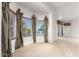 Bright bedroom featuring bay windows with elegant drapes and neutral wall tones at 1367 E Desert Flower Ln, Phoenix, AZ 85048