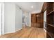 Bright hallway with built-in bookcase and hardwood floors at 1367 E Desert Flower Ln, Phoenix, AZ 85048