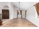 Bright dining area with hardwood floors and view to entry at 1367 E Desert Flower Ln, Phoenix, AZ 85048