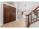 Elegant entryway with tile flooring, double doors, and a staircase at 1367 E Desert Flower Ln, Phoenix, AZ 85048