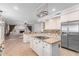 Modern kitchen with granite countertops, white cabinets and island at 1367 E Desert Flower Ln, Phoenix, AZ 85048
