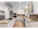 Spacious kitchen featuring granite countertops and ample cabinet space at 1367 E Desert Flower Ln, Phoenix, AZ 85048