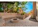Stone patio with fire pit, perfect for outdoor entertaining at 1367 E Desert Flower Ln, Phoenix, AZ 85048