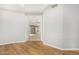 Hallway with hardwood floors leading to bedrooms and other rooms at 1367 E Desert Flower Ln, Phoenix, AZ 85048