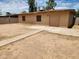 Large backyard with concrete patio and storage shed at 2833 W Marlette Ave, Phoenix, AZ 85017