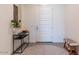 Bright entryway with console table and rug at 22842 E Via Las Brisas Vly, Queen Creek, AZ 85142