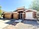 Cute ranch-style home with a two-car garage and landscaped yard at 1773 E Cardinal Dr, Casa Grande, AZ 85122