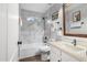 Clean bathroom with marble-look tile, a bathtub, and a modern vanity at 7207 N 175Th Ave, Waddell, AZ 85355