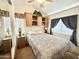 Bedroom with built-in shelving and mirrored closet at 1051 S Quartz Dr, Apache Junction, AZ 85119