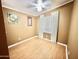 Well-lit bedroom with light brown laminate flooring and window coverings at 9427 E University Dr # 100, Mesa, AZ 85207