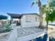 Mobile home with covered porch and landscaping at 9427 E University Dr # 100, Mesa, AZ 85207