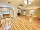 Kitchen with wood cabinets and laminate flooring, open to living area at 9427 E University Dr # 100, Mesa, AZ 85207