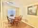 Dining room with a round wooden table and matching chairs at 9427 E University Dr # 100, Mesa, AZ 85207